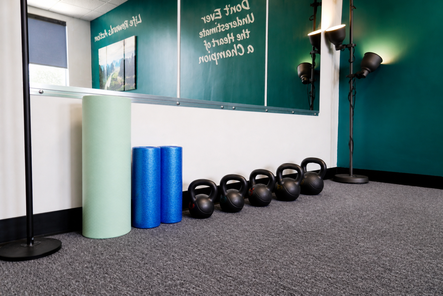 Foam rollers and kettlebells arranged inside the DeepStretch+ studio